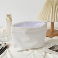 White corduroy cosmetic bag with light purple lining and silver zipper closure - White