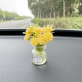 Car dashboard ornament featuring a yellow mini bouquet in a transparent glass vase - Yellow Babysbreath