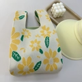 Knitted handbag in cream with large yellow daisy patterns and integrated handle style - Yellow Daisy