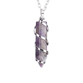 Detailed macro view of amethyst hexagonal pendant with silver spiral wire wrap design - Silver + Amethyst