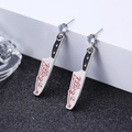 Detailed shot of creative silver punk earrings in kitchen knife shape with Killing It text - Punk Chef Knife Stud White K (9502)