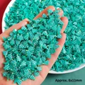 Close-up of mint green resin Christmas tree charms for DIY crafts, approx. 8x11mm size - 1 Piece / Mini Christmas Tree