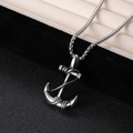 Silver anchor pendant necklace with rope design on a black textured surface - Anchor