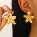 Elegant gold flower earrings with crumpled texture worn by a model in a close-up studio shot - Flower Necklace (N-1076) / KC Gold