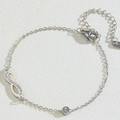 Pulsera de acero de titanio plateado con símbolo infinito y colgante de diamantes - Pulsera Color Acero (M209)