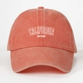 Detailed close-up of California West Coast embroidery on a washed orange cotton baseball cap - One Size / Orange