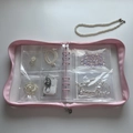 Macro detail of pink loose-leaf jewelry storage book with transparent PVC zipper bags - Pink Zipper Binder (No Pages)