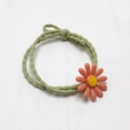Green wavy hair tie featuring a sweet orange-pink daisy flower charm for girls - Green Rope with Orange Flower