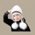 Winter knit baby hat featuring black and white houndstooth pattern with white pom-poms - Children's Three-ball White (ages 2-8)