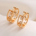 Minimalist 18K gold plated U-shaped earrings with hollow star patterns and cubic zirconia - Gold