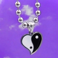 Detail of heart pendant with black and white yin yang pattern on silver beaded chain - Yin Yang Heart