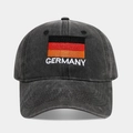 Detailed close-up of Germany flag embroidery on a washed black cotton baseball cap - Adjustable / Germany Flag