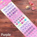 Macro detail of purple 3D crystal gem stickers in heart and flower shapes for DIY decor - Shell Series Purple