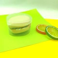 Set of two skin-tone XL air cushion sponges in a clear round storage case with lemon props - Marshmallow 2 Pieces (XL) Boxed