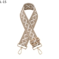 Close-up of geometric woven strap with Greek fret pattern and gold metal buckles - Khaki