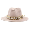 Detail of light pink straw hat with shell and wood bead trim on a woven fedora band - Nude Pink
