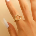 Detailed view of gold plated alloy ring featuring an open hollow design with hammered texture - Minimalist Hollow Circular Hammered Ring (0187) / Gold