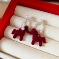 Detailed view of red flocked horse earrings with pearl accents in a jewelry gift box - 53# Red Flocking Pearl Unicorn Dangle Earrings (Pair)