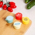 Detail of four cartoon mini sauce bottles with colorful lids on a wooden board - Round Letters / Multicolor/Set of 4