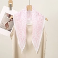 Detail of white scarf with pink paisley pattern hanging in a triangle shape - White with Pink Flowers