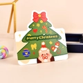 Christmas greeting card featuring a decorated tree and a bear wearing a Santa hat - Christmas Tree
