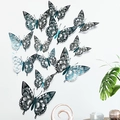 Detail of 3D cutout butterfly wall stickers with metallic teal gradient on white wall - Green