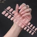 Macro shot of matte nude pink square false nails set with 24 pieces on plastic runner - Matte Nude Pink