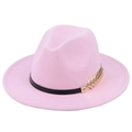 Detail of pink wool fedora hat featuring black ribbon and golden leaf metal ornament - Pink