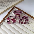 Medium wavy hair claw clip featuring elegant purple and beige multicolor acetate stripes - Purple Striped