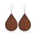 Macro shot of retro drop-shaped dark brown wood earrings with silver metal hooks - Style 1