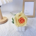 Handmade crocheted Thai rose in gradient yellow and orange yarn with a green stem - Thai Rose Gradient Orange