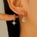 Elegant asymmetrical star and moon hoop earrings with cubic zirconia in silver finish - Asymmetric Silver Star Moon Dangle (WG-0381)