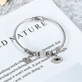 Pulsera de cable de acero plateado con colgante de ojo turco y cuentas brillantes - Color Acero