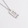 Detail of silver titanium steel pendant featuring hollow number 5 and lucky engraving - Number 5