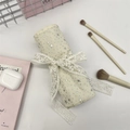 Chic beige fabric cosmetic roll-up organizer with lace ties and gold star patterns - Starry White