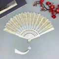 White lace folding fan with golden embroidery, white tassel and decorative red plum - With Large Tassel / White