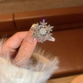 Macro shot of silver snowflake brooch with sparkling rhinestones and a white pearl detail - 13# Silver Small Snowflake Duckbill Clip (GA0313)