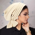 Elegant beige turban for women with knitted texture and side fixed bow detail - Beige