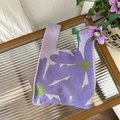Macro detail of purple knit tote bag showing intricate floral pattern and fabric texture - Kapok Purple