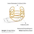 Detailed view of hammered 18K gold plated stainless steel hollow geometric open bangle - Gold Cross Hollow Style (YYBL025075)