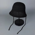 Detail of black breathable knit bucket hat with ties on a display stand - M (56-58cm) / Black