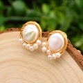 Handcrafted vintage baroque pearl earrings wrapped in gold wire on a natural wood slice - Flat Pearl Style