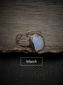 Macro detail of a raw March birthstone set in an adjustable antique copper ring - March - Aquamarine