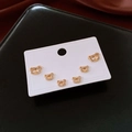 Macro view of gold plated bear earrings with sparkling cubic zirconia on a white card - 6-Piece Set / Gold
