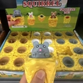 Squeeze toy featuring a grey mouse popping out of a yellow cheese block for stress relief - Cheese Mouse Squeeze Toy