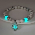 Glow-in-the-dark blue lotus pendant and marble beads on a luminous yoga bracelet - 8mm Natural White Turquoise with Blue-Green Light