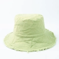 Detail of light green bucket hat with frayed edges and vintage washed canvas texture - Light Green