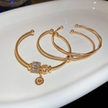 Detailed view of luxury gold bangle set with sparkling heart pendant and twisted textures - 5# Bracelet (HB4515)
