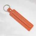 Bright orange faux leather keychain strap with silver metal ring and rivet detail - 8mm / Orange