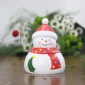 Handcrafted wooden snowman figurine with red hat and star tree detail, 9.5cm height - Small Snowman